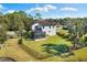 Aerial view showcasing the house and large backyard with a privacy fence at 7876 Marsh Pointe Dr, Tampa, FL 33635