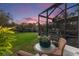 Screened patio overlooking a lush backyard at 7876 Marsh Pointe Dr, Tampa, FL 33635