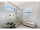 Spa-like bathroom with a large glass shower, double shower heads, and a bench at 7876 Marsh Pointe Dr, Tampa, FL 33635