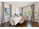 Bright dining room with hardwood floors and beige upholstered chairs at 7876 Marsh Pointe Dr, Tampa, FL 33635