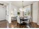 Formal dining area with a round table, chandelier, and neutral color scheme at 7876 Marsh Pointe Dr, Tampa, FL 33635