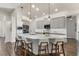 Modern kitchen features a large island with seating and sleek cabinetry at 7876 Marsh Pointe Dr, Tampa, FL 33635