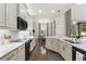 Bright kitchen featuring ample counter space, stainless steel appliances, and hardwood floors at 7876 Marsh Pointe Dr, Tampa, FL 33635