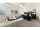 Main bedroom with sitting area and large windows at 7876 Marsh Pointe Dr, Tampa, FL 33635