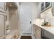 Functional mudroom with built-in cabinetry, marble countertops, and ample storage at 7876 Marsh Pointe Dr, Tampa, FL 33635