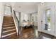 Elegant staircase with a modern metal railing and hardwood steps at 7876 Marsh Pointe Dr, Tampa, FL 33635