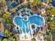 Aerial view of community pool and surrounding landscape at 8506 Hunters Fork Loop, Ruskin, FL 33573