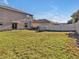 Large backyard with grassy area and picnic table at 8506 Hunters Fork Loop, Ruskin, FL 33573