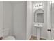 Simple bathroom with pedestal sink and toilet at 8506 Hunters Fork Loop, Ruskin, FL 33573