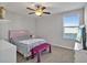 Bedroom with a double bed, bench, and window at 8506 Hunters Fork Loop, Ruskin, FL 33573
