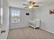 Spacious bedroom with crib and large window at 8506 Hunters Fork Loop, Ruskin, FL 33573