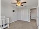 Bedroom with crib, closet, and window at 8506 Hunters Fork Loop, Ruskin, FL 33573
