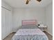 Bright bedroom with double bed, closet, and window at 8506 Hunters Fork Loop, Ruskin, FL 33573