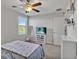 Bedroom with a double bed, dresser, and TV at 8506 Hunters Fork Loop, Ruskin, FL 33573