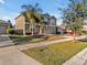 Two-story house with palm trees and a driveway at 8506 Hunters Fork Loop, Ruskin, FL 33573