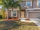 Two-story house with a front door and landscaping at 8506 Hunters Fork Loop, Ruskin, FL 33573