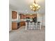 Kitchen with island, dark cabinets, and granite countertops at 8506 Hunters Fork Loop, Ruskin, FL 33573