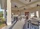 Outdoor kitchen and dining area with ceiling fans at 8506 Hunters Fork Loop, Ruskin, FL 33573