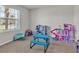 Playroom with toys and a large window at 8506 Hunters Fork Loop, Ruskin, FL 33573