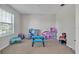 Playroom with toys and a large window at 8506 Hunters Fork Loop, Ruskin, FL 33573