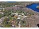 Aerial view of property near lake with surrounding homes at 8537 Cameo Dr, New Port Richey, FL 34654