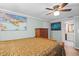 Bright bedroom with double bed, dresser, and ceiling fan at 8537 Cameo Dr, New Port Richey, FL 34654