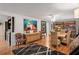 Dining room with hardwood floors, built-in shelving and large art at 8537 Cameo Dr, New Port Richey, FL 34654