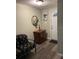Entryway with a small seating area and wood-look floors at 8537 Cameo Dr, New Port Richey, FL 34654