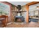 Stone fireplace with wood mantel and hearth in living room at 8537 Cameo Dr, New Port Richey, FL 34654