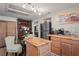 Eat-in kitchen with island seating, stainless steel appliances & wood cabinets at 8537 Cameo Dr, New Port Richey, FL 34654