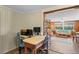 Home office with a work desk and view into the living room at 8537 Cameo Dr, New Port Richey, FL 34654