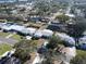 Wide aerial view showcasing the house and neighborhood at 10904 90Th Ter, Seminole, FL 33772