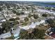 Aerial view of houses, yards, and neighborhood streets near water at 10904 90Th Ter, Seminole, FL 33772