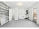 Clean, spacious basement with built-in shelving and a toilet at 10904 90Th Ter, Seminole, FL 33772