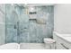 Spa-like bathroom with a walk-in shower and marble tile at 10904 90Th Ter, Seminole, FL 33772