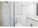 Clean bathroom with white vanity and a walk in shower at 10904 90Th Ter, Seminole, FL 33772
