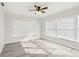 Bright bedroom with vinyl plank flooring and ceiling fan at 10904 90Th Ter, Seminole, FL 33772