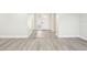 Bright entryway with vinyl plank flooring and glass block window at 10904 90Th Ter, Seminole, FL 33772
