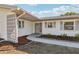 Front entrance with decorative screen and walkway at 10904 90Th Ter, Seminole, FL 33772