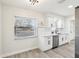 Modern kitchen featuring white shaker cabinets and stainless steel appliances at 10904 90Th Ter, Seminole, FL 33772