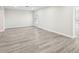 Bright living room with gray vinyl plank flooring at 10904 90Th Ter, Seminole, FL 33772