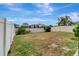 Fenced-in backyard with grassy area at 1107 Seminole Sky Dr, Ruskin, FL 33570
