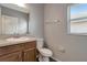 Clean bathroom with granite vanity and neutral color scheme at 1107 Seminole Sky Dr, Ruskin, FL 33570