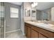 Bathroom boasts double sinks and granite countertop at 1107 Seminole Sky Dr, Ruskin, FL 33570