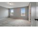 Spacious bedroom with neutral walls and plush carpeting at 1107 Seminole Sky Dr, Ruskin, FL 33570