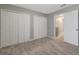 Bedroom with double closets and access to hallway at 1107 Seminole Sky Dr, Ruskin, FL 33570