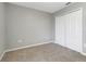 Spacious bedroom with gray walls and carpeting at 1107 Seminole Sky Dr, Ruskin, FL 33570