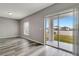Bright dining room with sliding glass doors leading to the backyard at 1107 Seminole Sky Dr, Ruskin, FL 33570