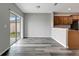 Bright dining area with wood-look floors, slider to patio, and kitchen access at 1107 Seminole Sky Dr, Ruskin, FL 33570