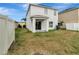 Two-story house with backyard and covered patio at 1107 Seminole Sky Dr, Ruskin, FL 33570